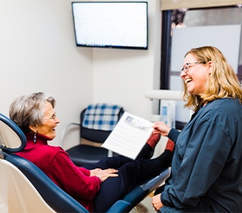 Dentist and patient looking at intraoral images