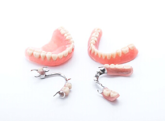 two full dentures and two partials
