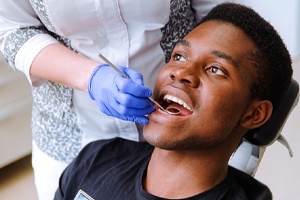 patient visiting his Falmouth implant dentist for regular checkup