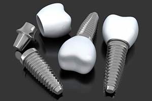 three dental implants lying on a flat surface