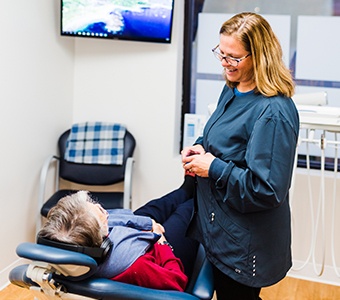 Woman receiving teeth whitening treatment