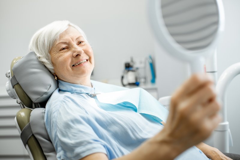 Smiling woman in dentist's chair