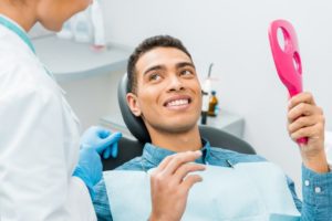 Smiling male patient attending dental checkup in Falmouth