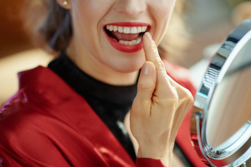 Woman pointing to dental bonding