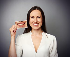 Woman smiles after treating gray teeth in Falmouth