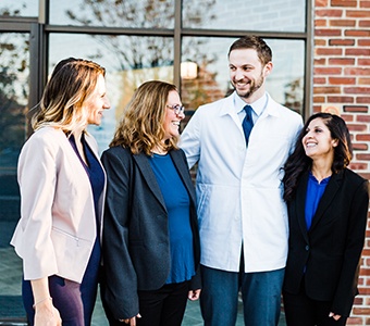 Dr. McVety and his team at Casco Bay Smiles discussing a smile makeover plan