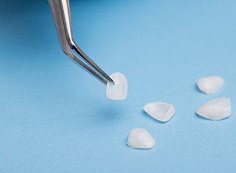 Dental technician preparing a porcelain veneer restoration